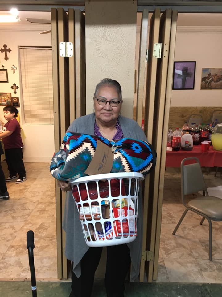 Presenting gifts to an American Indian elder.
