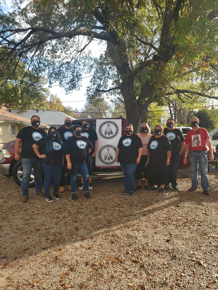 ICCT members holding the Intertribal Community Council of Texas banner at a community event.
